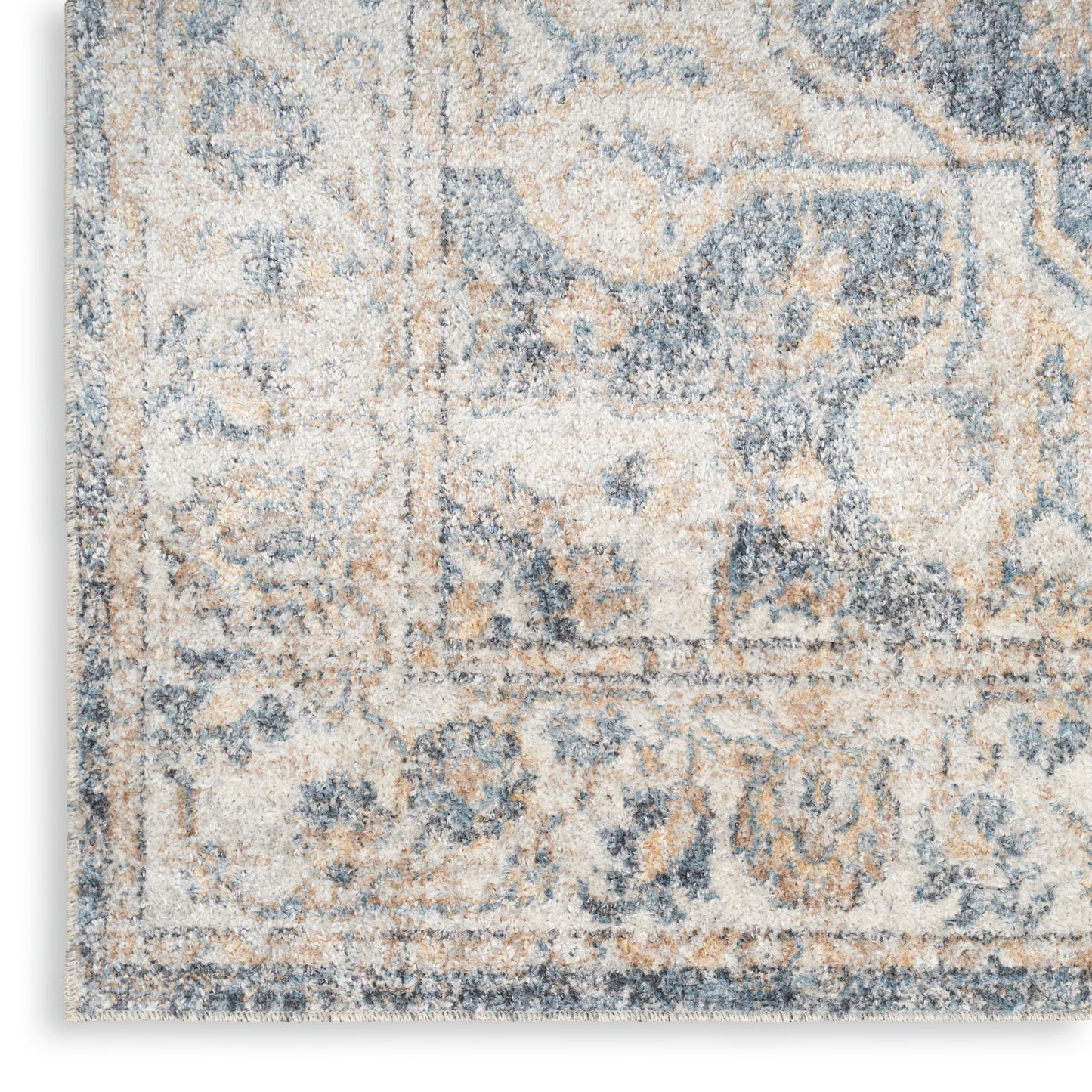 Blue and ivory distressed ornate patterned area rug with plush pile, vintage-style floor decor.