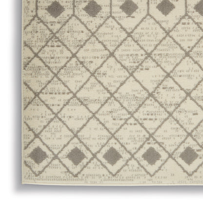 Beige woven rug with taupe diamond lattice pattern and small square accents; neutral geometric style for living spaces.