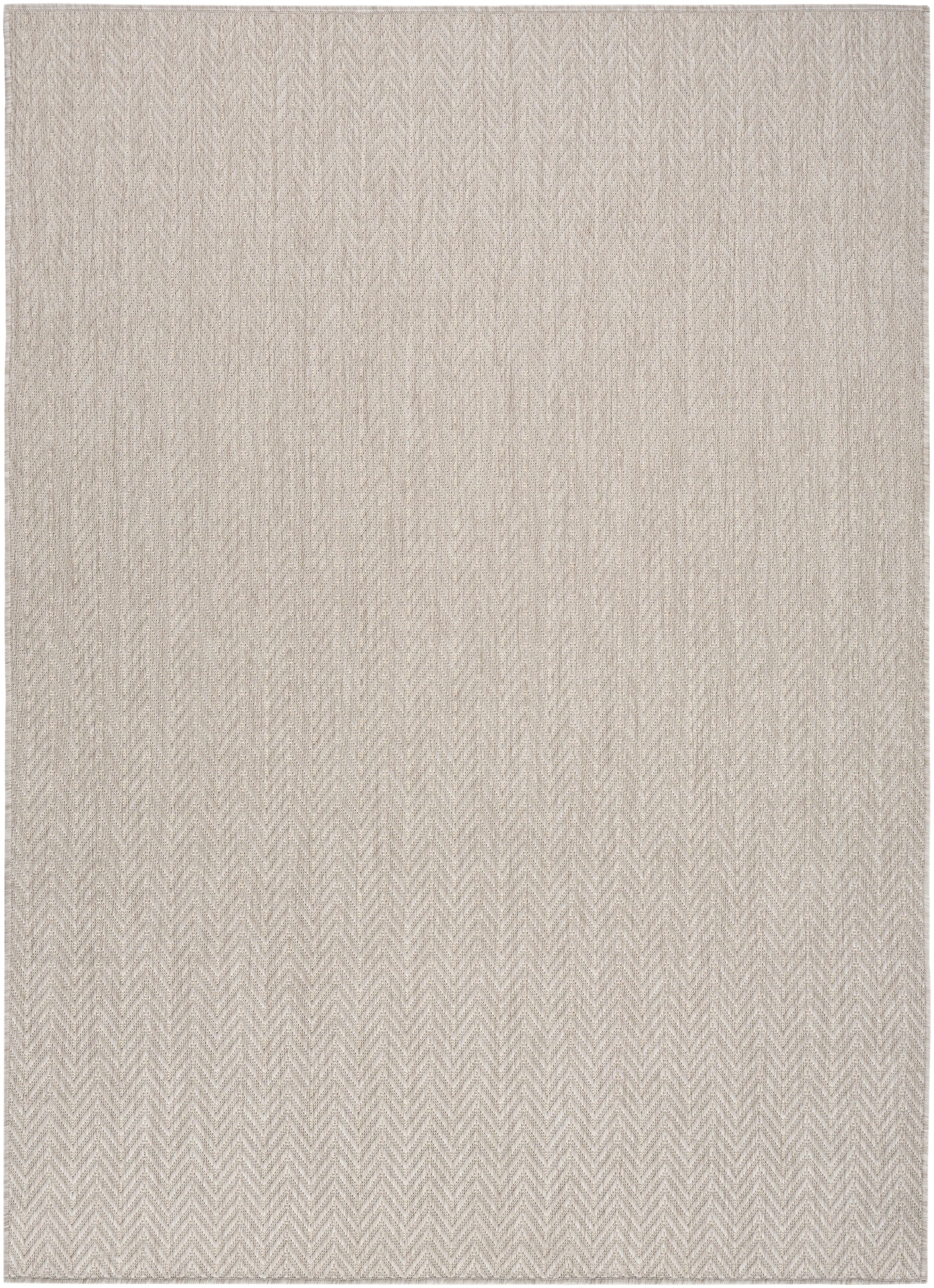 Beige rectangular rug with a subtle herringbone chevron pattern and soft woven texture.