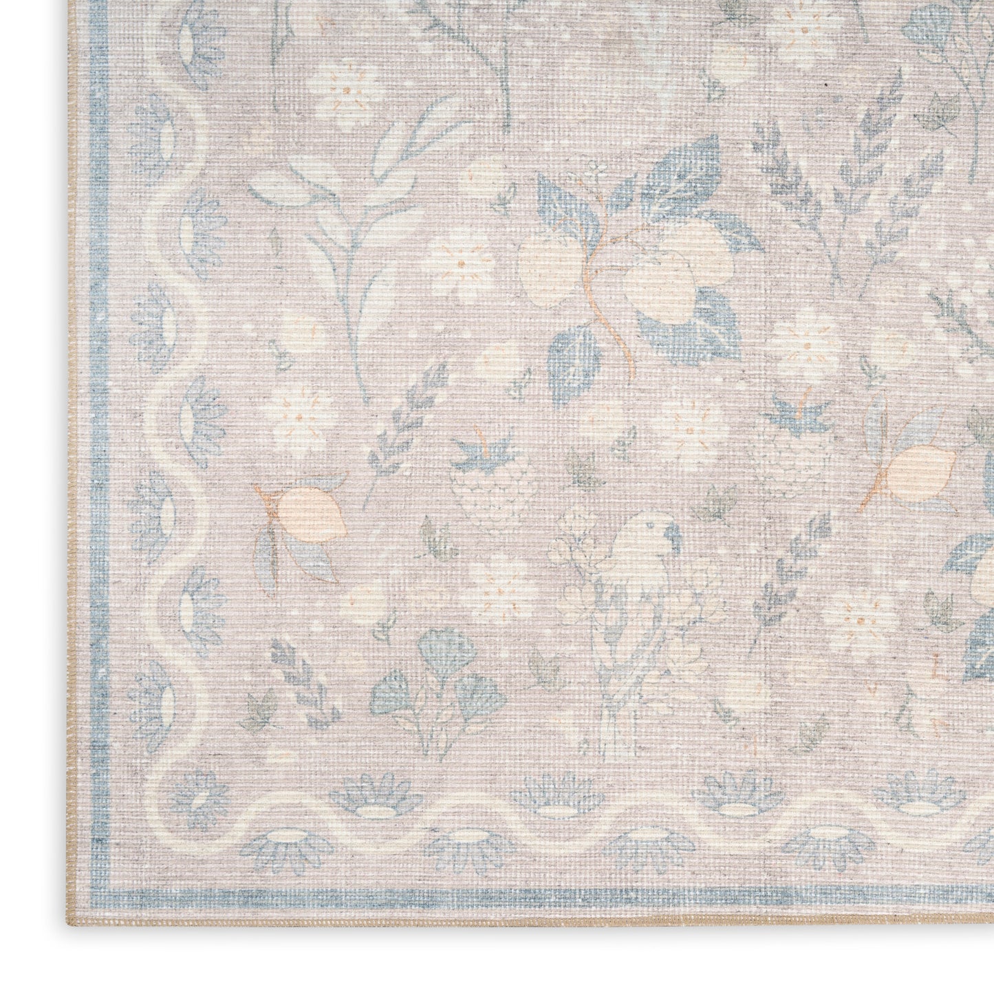 Pastel floral area rug with pale pink background, blue flowers and vines, and a light blue border.