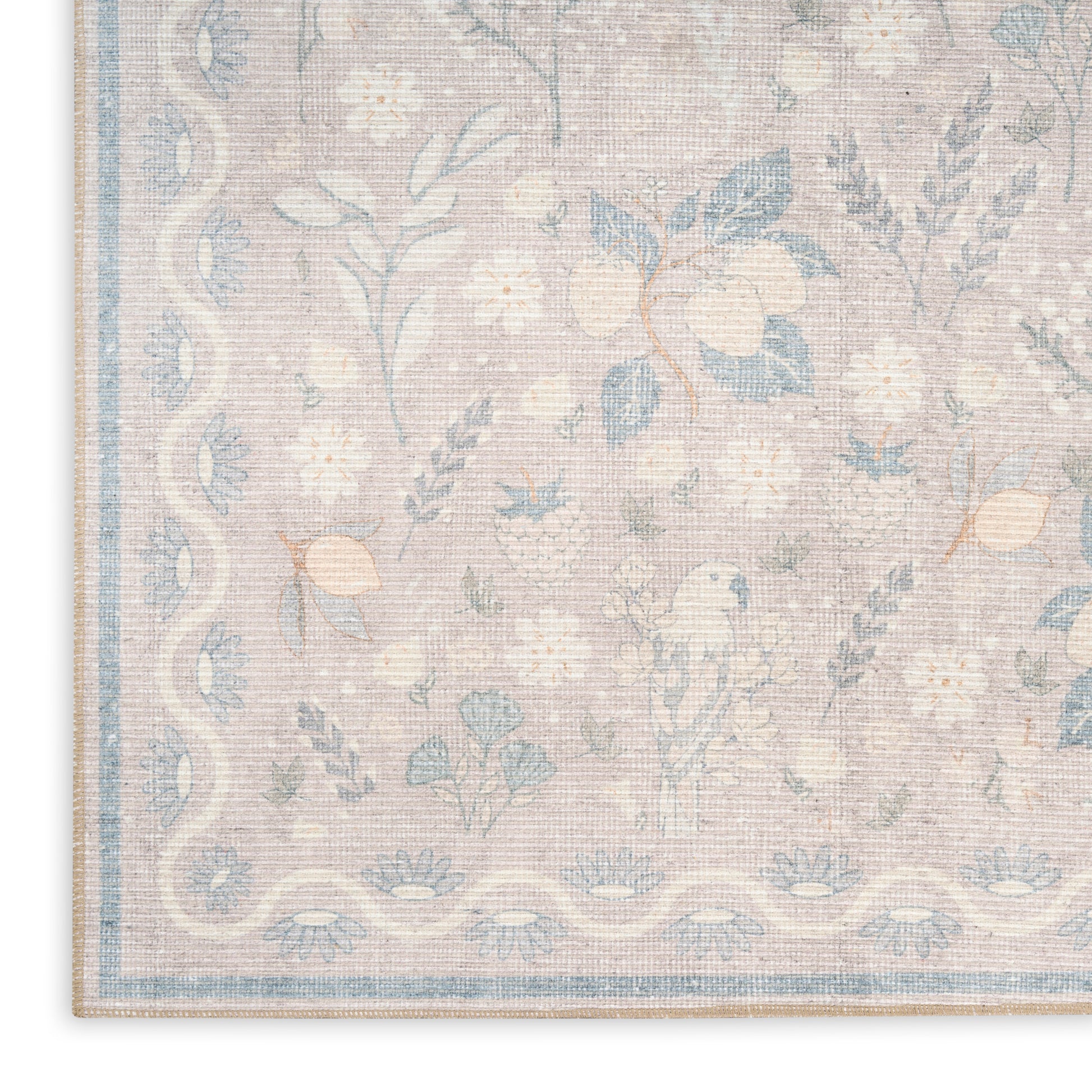 Pastel floral area rug with pale pink background, blue flowers and vines, and a light blue border.