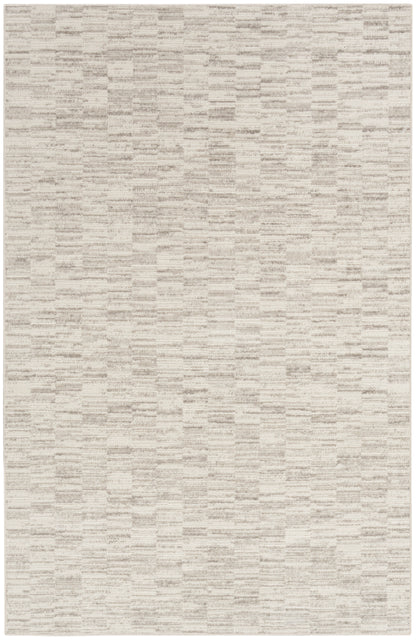Beige rectangular woven rug with soft texture and subtle tonal streaks; ideal neutral accent.