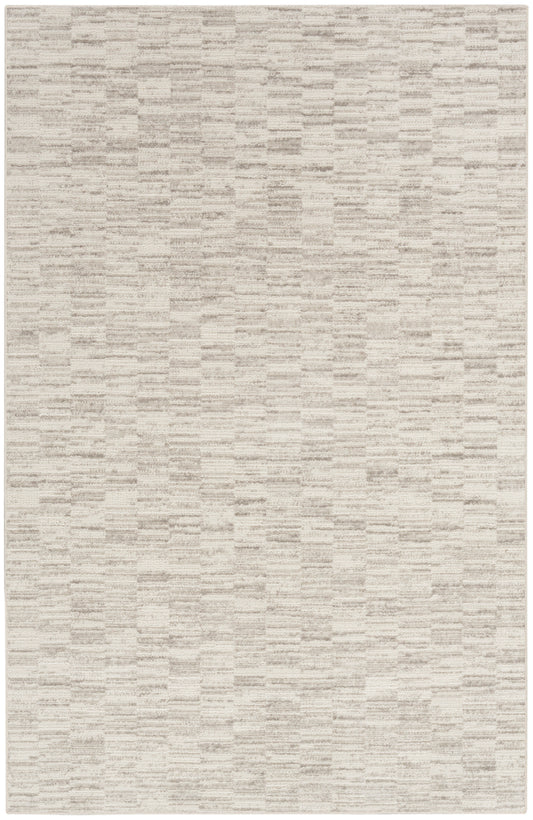 Beige rectangular woven rug with soft texture and subtle tonal streaks; ideal neutral accent.