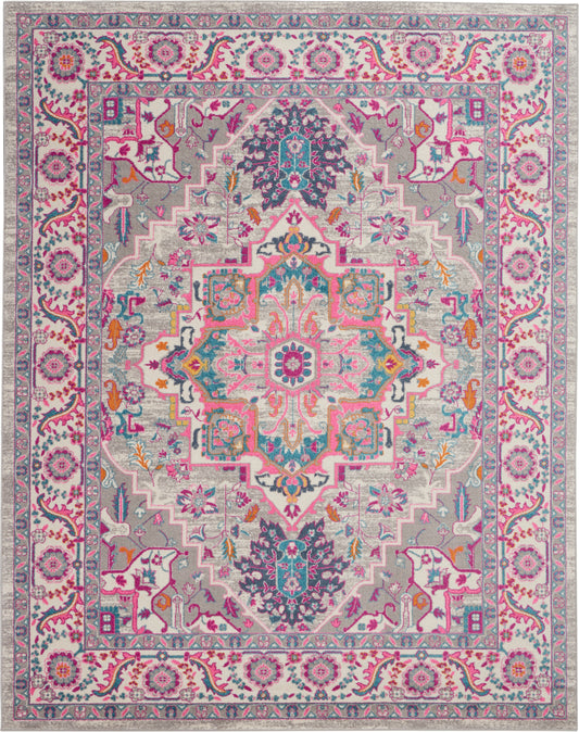 Colorful Bohemian-style area rug with pink, turquoise, purple and cream, ornate central medallion and floral borders, 7' x 10'.