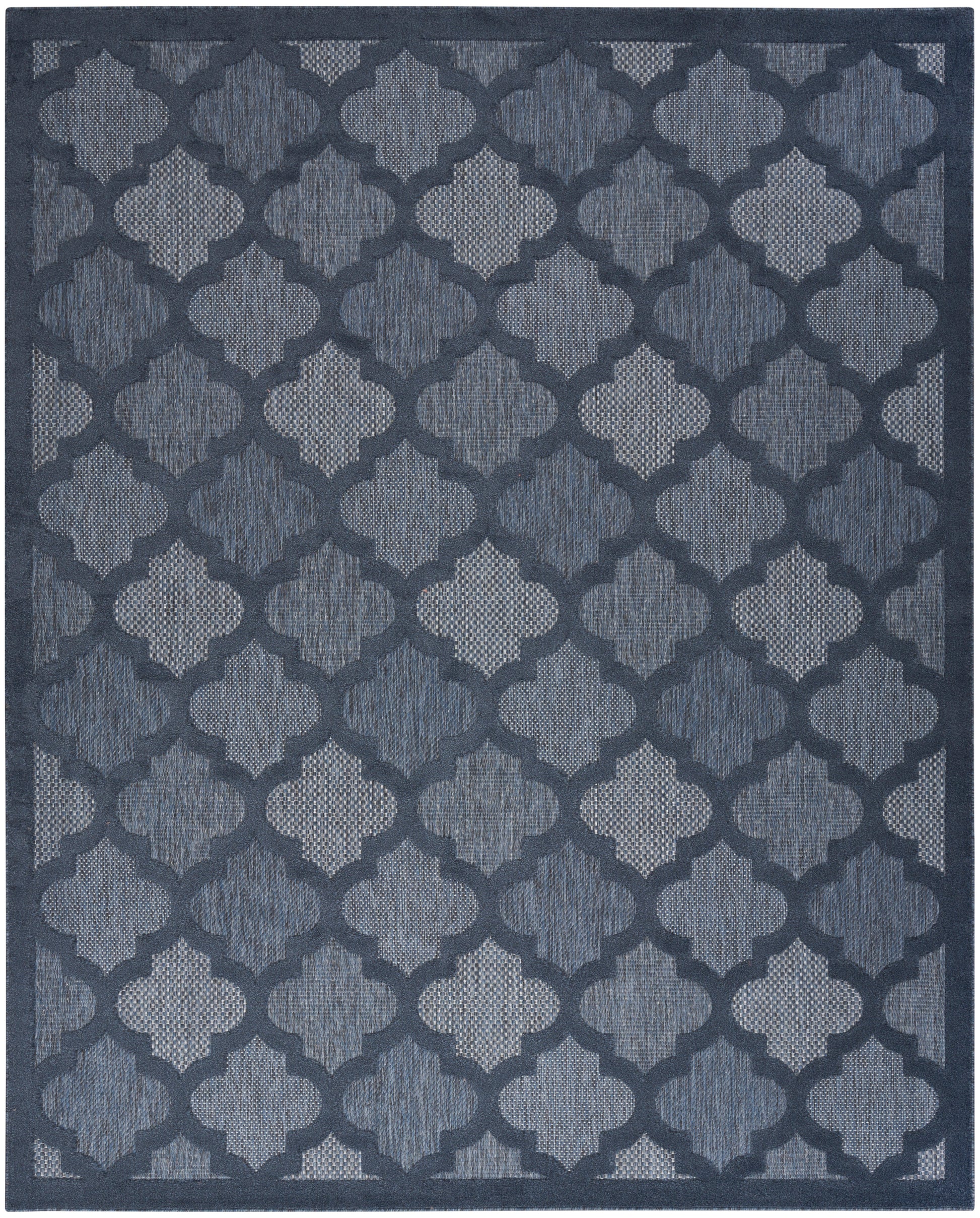 Navy blue rug with a repeating light-blue trellis pattern and a textured woven surface.