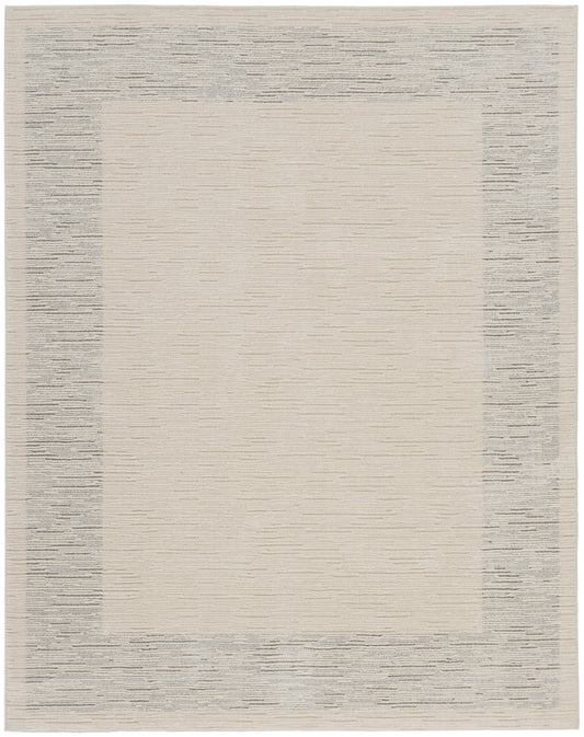 Rectangular beige rug with a pale gray speckled border; minimalist modern, low-pile textile.