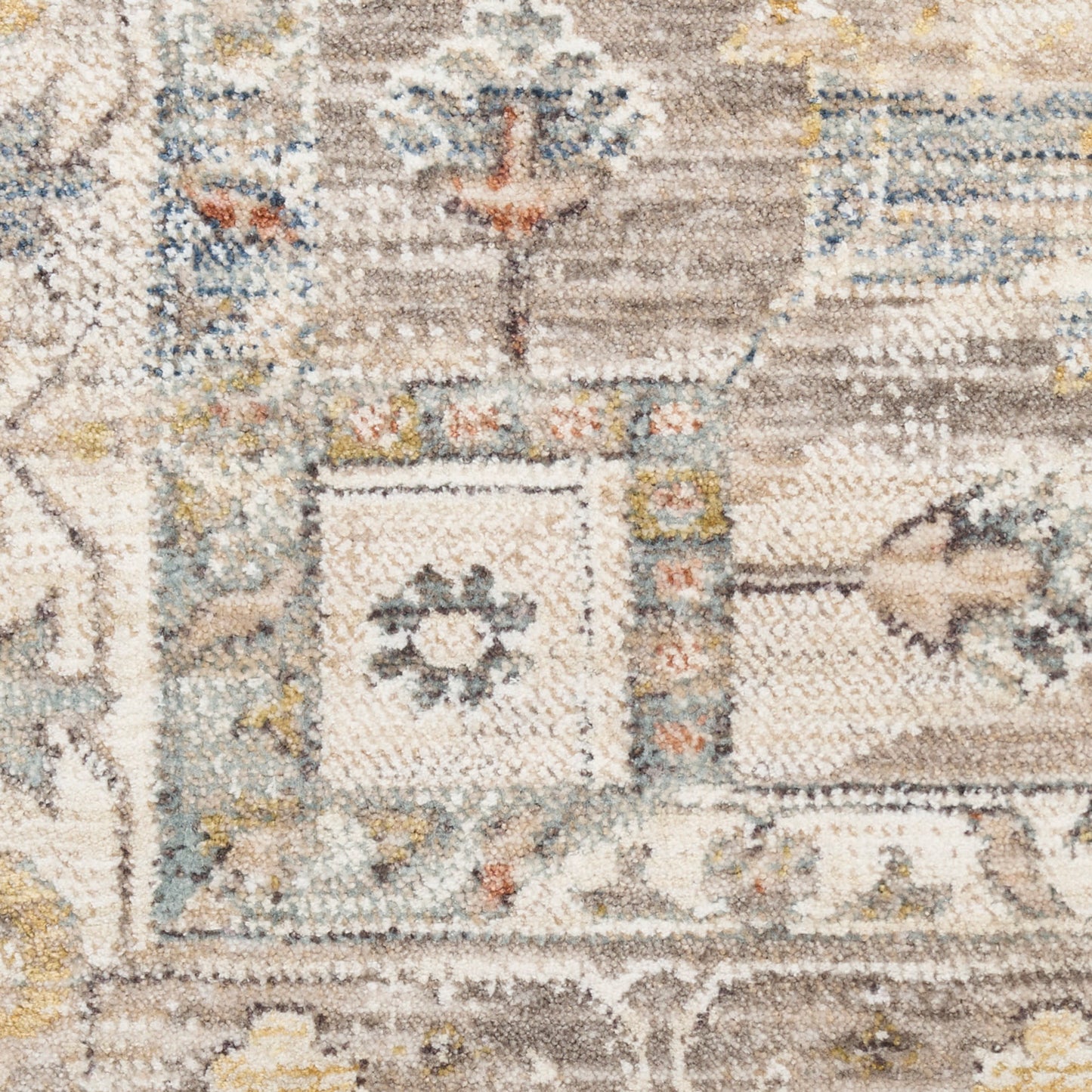 Beige vintage-area rug with muted blue & yellow accents; ornate geometric & floral patterns.