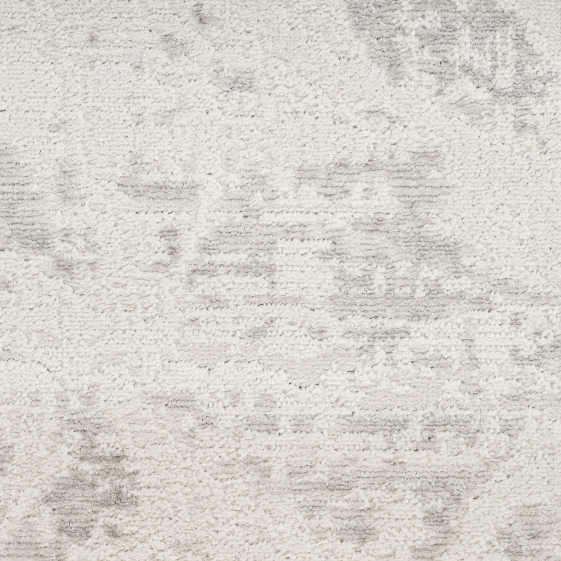 Cream textured rug with subtle gray abstract pattern and soft pile; versatile living room accessory.