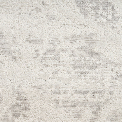 Cream textured rug with subtle gray abstract pattern and soft pile; versatile living room accessory.