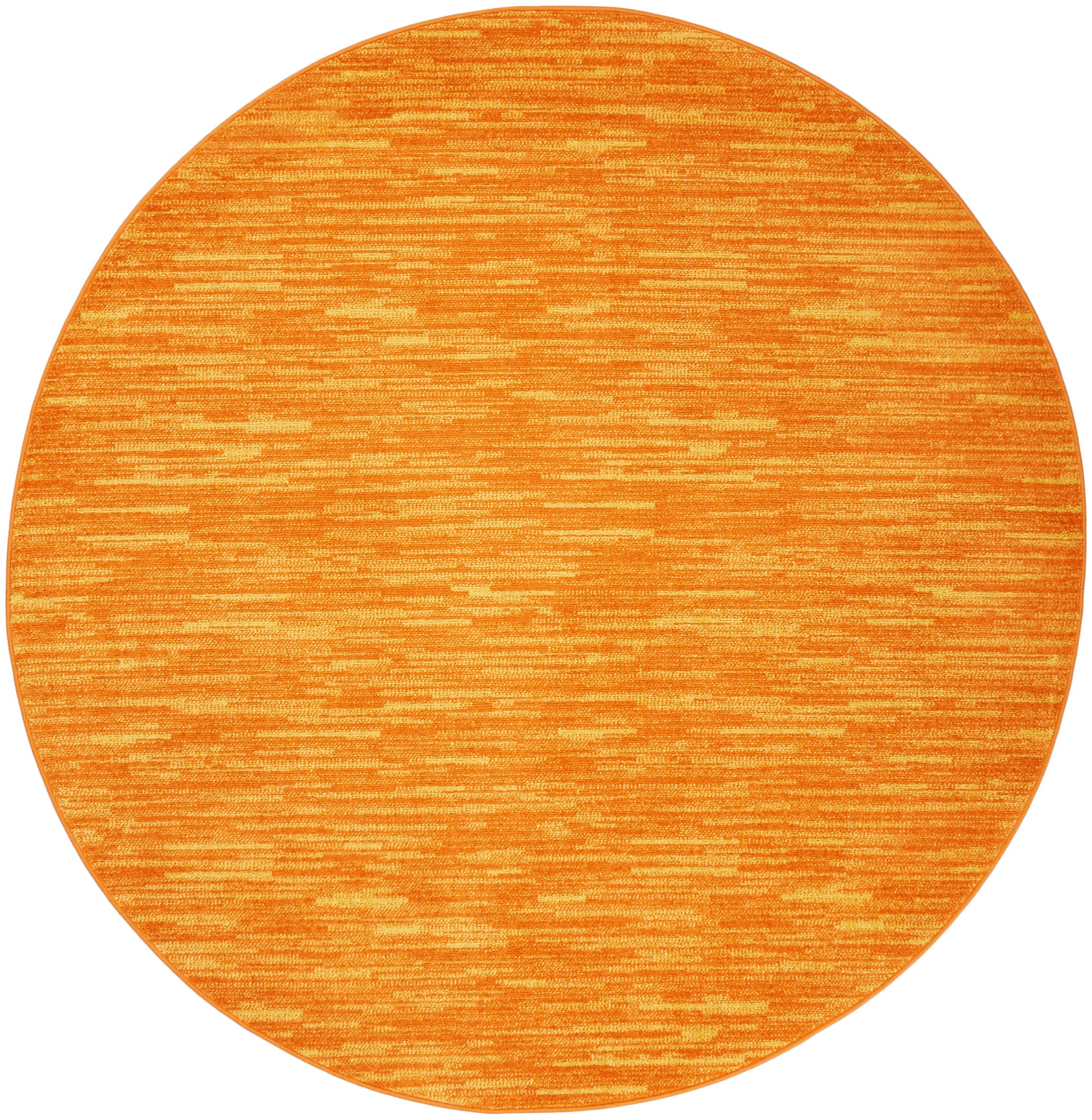 Round orange outdoor rug with subtle striped texture and warm tonal variation.
