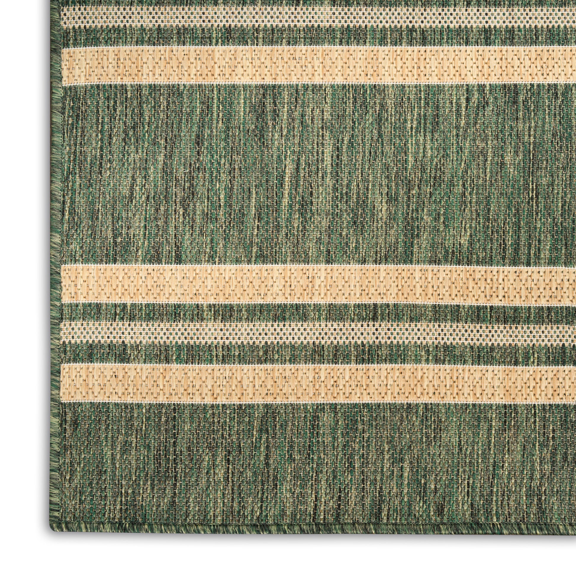 Green textured rug with beige horizontal dotted stripes in a woven pattern, close-up corner view.