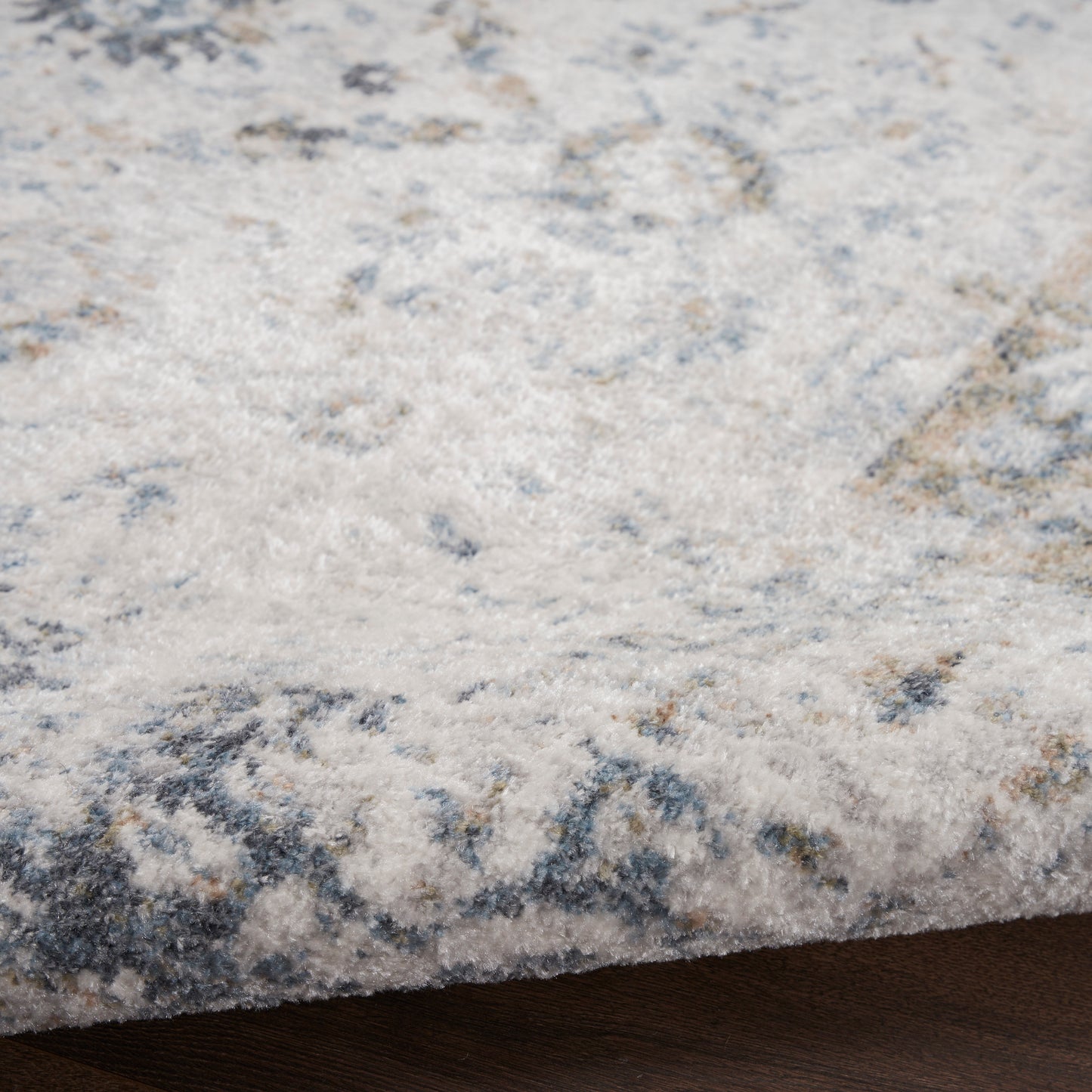Cream and blue-gray abstract rug with soft pile; rectangular area rug for living spaces.