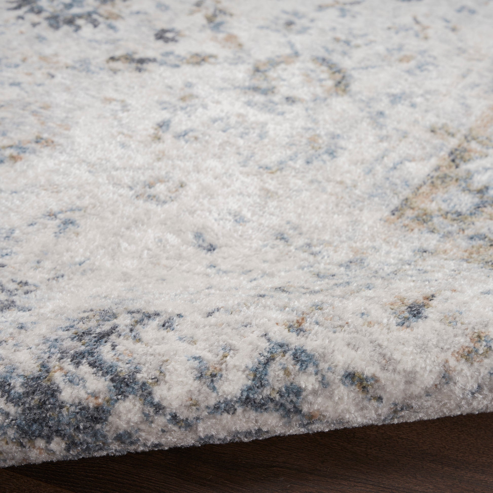 Cream and blue-gray abstract rug with soft pile; rectangular area rug for living spaces.