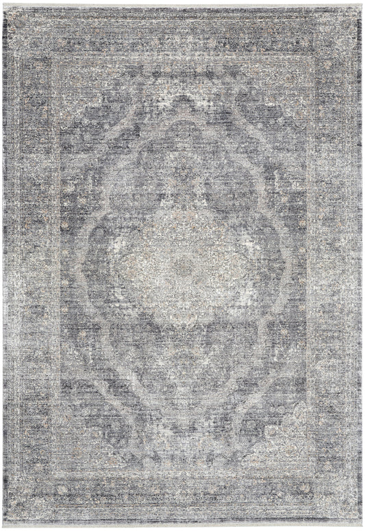 Rectangular vintage-style gray-blue distressed rug with central medallion and ornate border, soft woven texture.