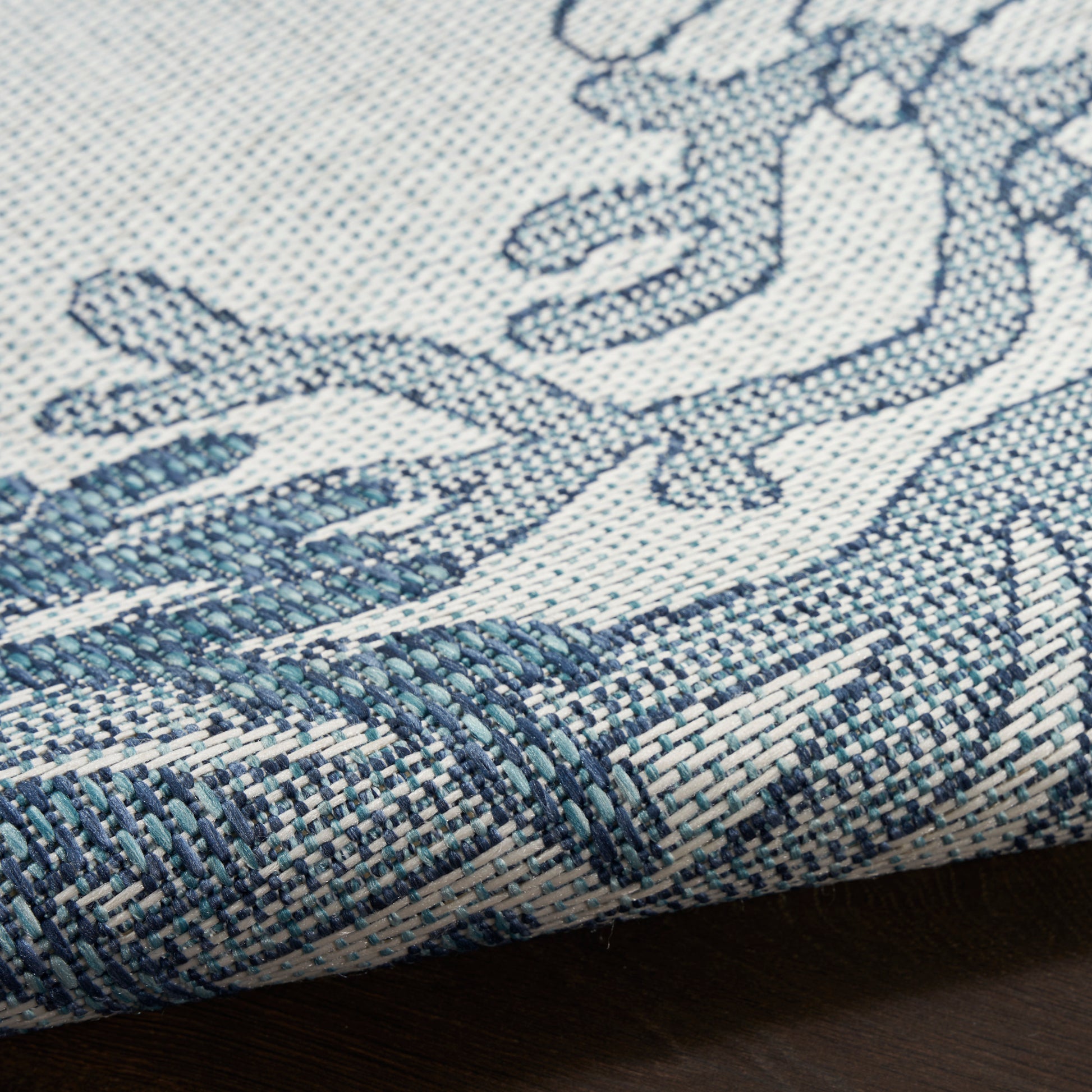 Blue & white damask-style woven textile with dense weave & folded edge; ideal as rug, runner & throw.