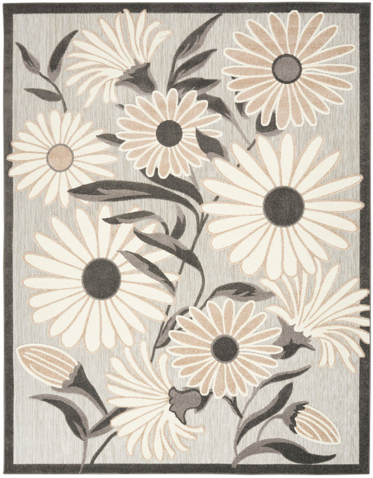 Rectangular area rug featuring large cream and beige daisies on a gray background with dark border and charcoal centers.