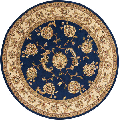 Round rug with deep blue center and cream-gold floral border featuring intricate vines and blossoms.