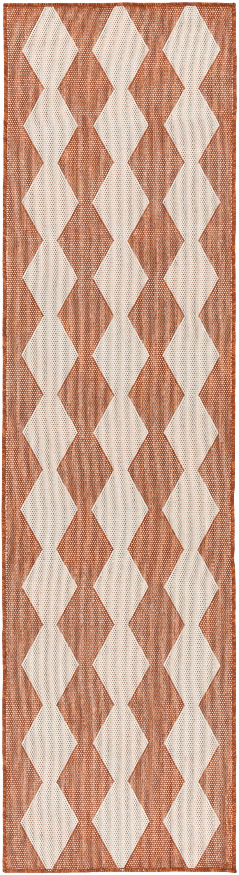 Geometric rug runner for hallway with cream and rust orange diamond pattern, woven texture, bordered edges.