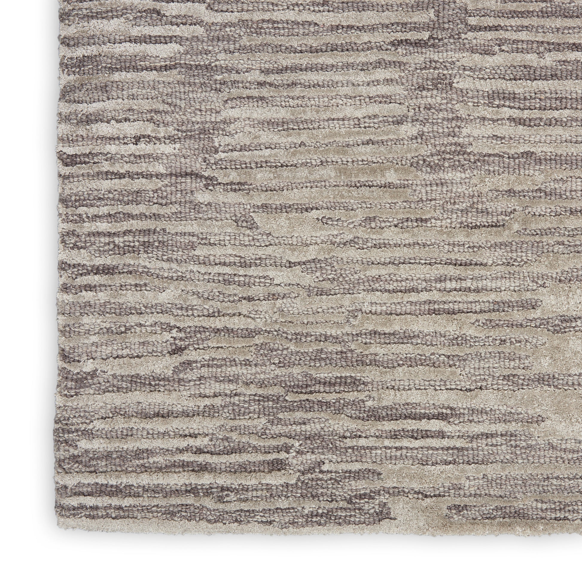Beige and taupe textured area rug with subtle wavy stripe pattern and plush pile.