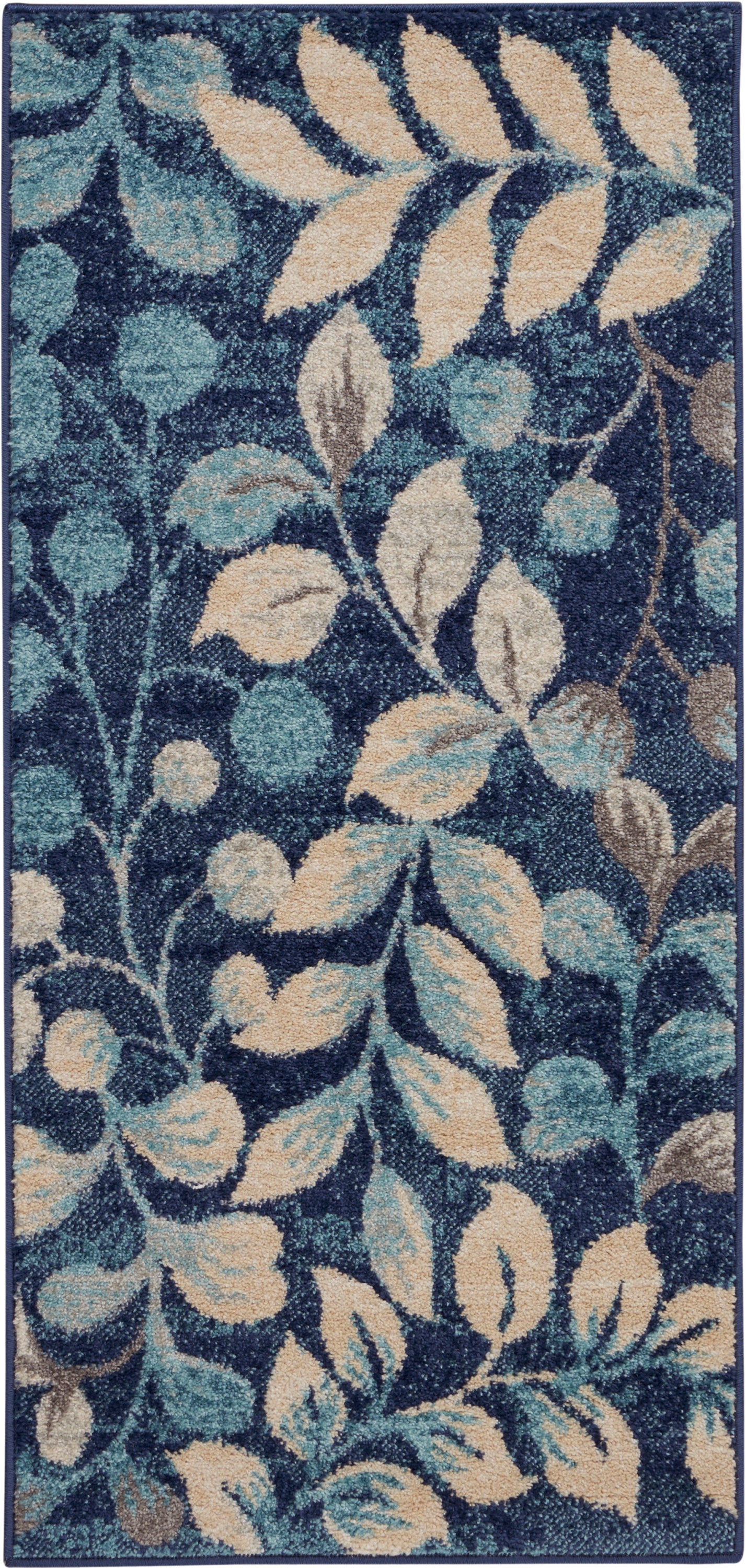 Navy blue rug with cream and teal botanical leaves; rectangular area rug.
