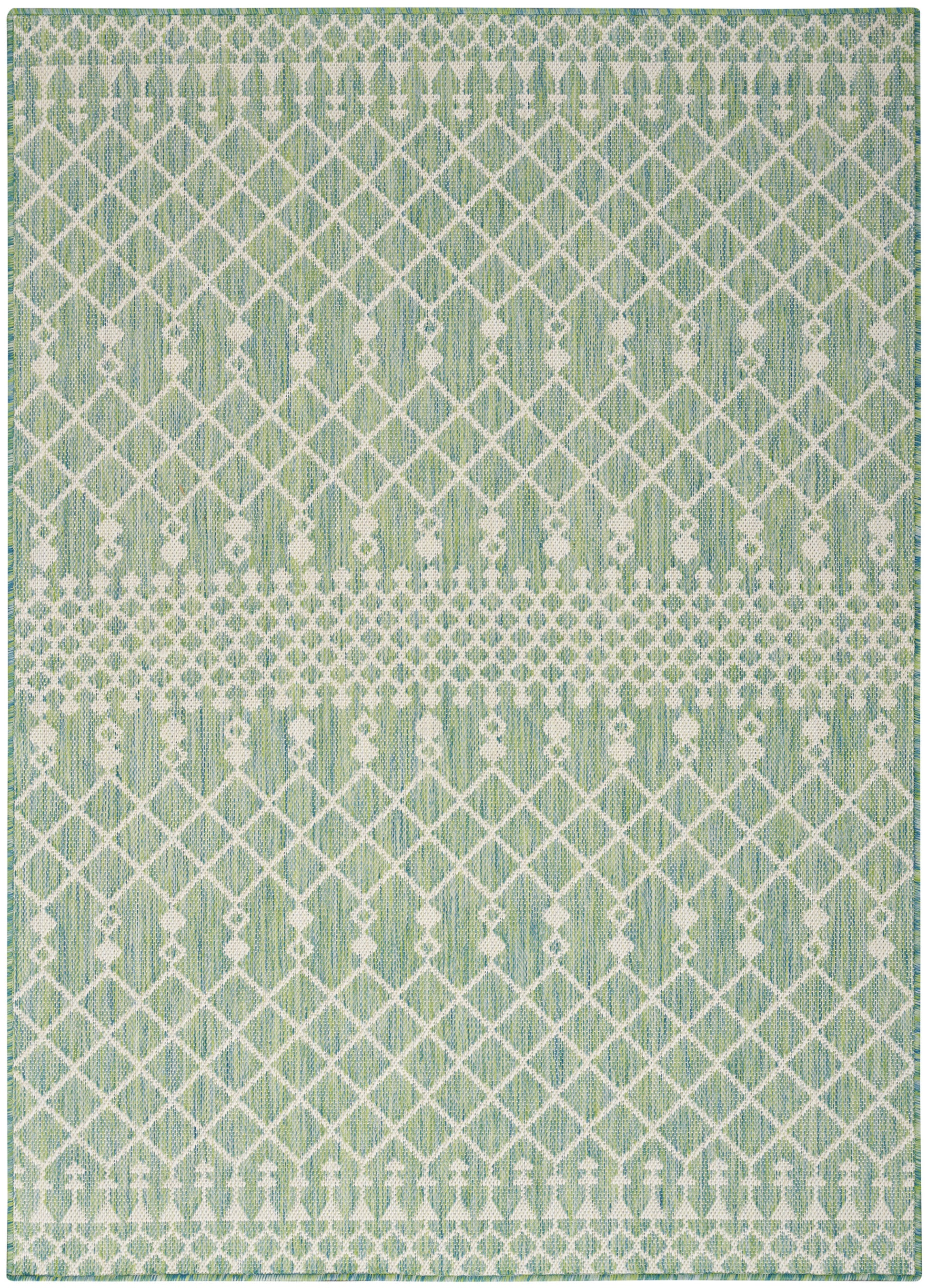 Mint-green rug with white lattice diamond pattern and dotted horizontal bands; geometric, modern look.