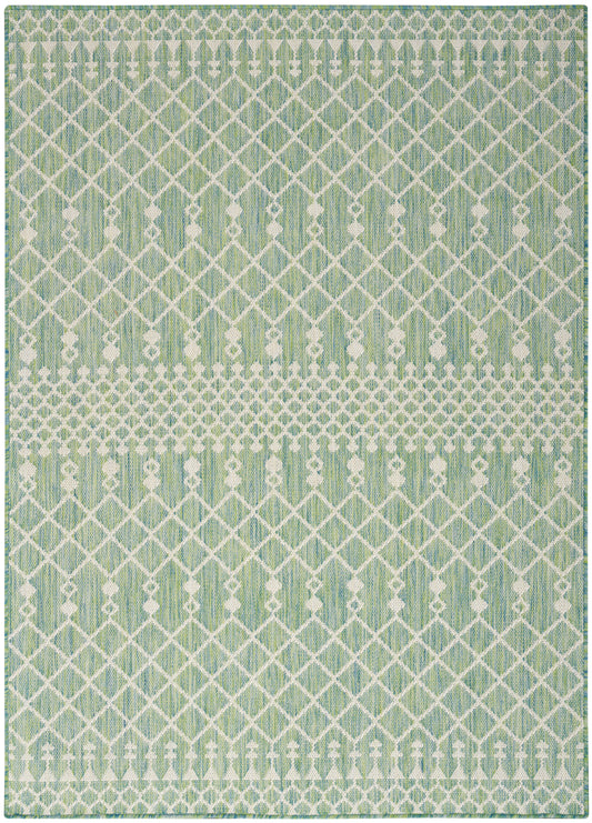Mint-green rug with white lattice diamond pattern and dotted horizontal bands; geometric, modern look.