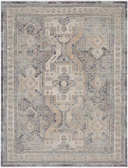 Distressed vintage oriental rug in muted blue-gray and beige with central geometric medallion and ornate border.