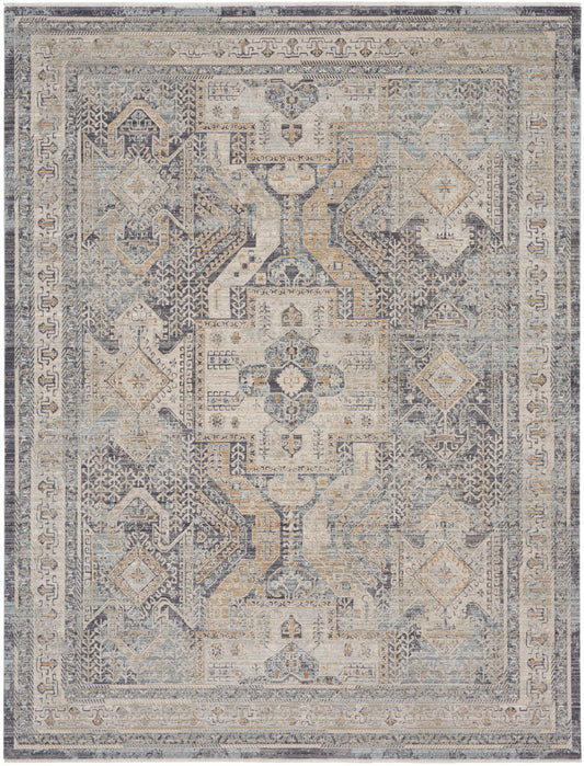 Distressed vintage oriental rug in muted blue-gray and beige with central geometric medallion and ornate border.