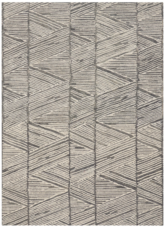 Rectangular area rug in beige and gray with a geometric chevron pattern and textured woven surface.