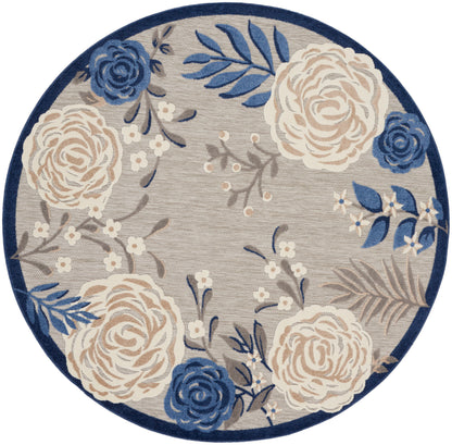 Round floral area rug featuring blue & cream roses on a gray background with a navy border.
