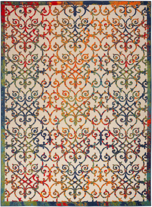 Rectangular rug with colorful ornate scrolling pattern in rainbow hues on beige, framed by a dark blue border.