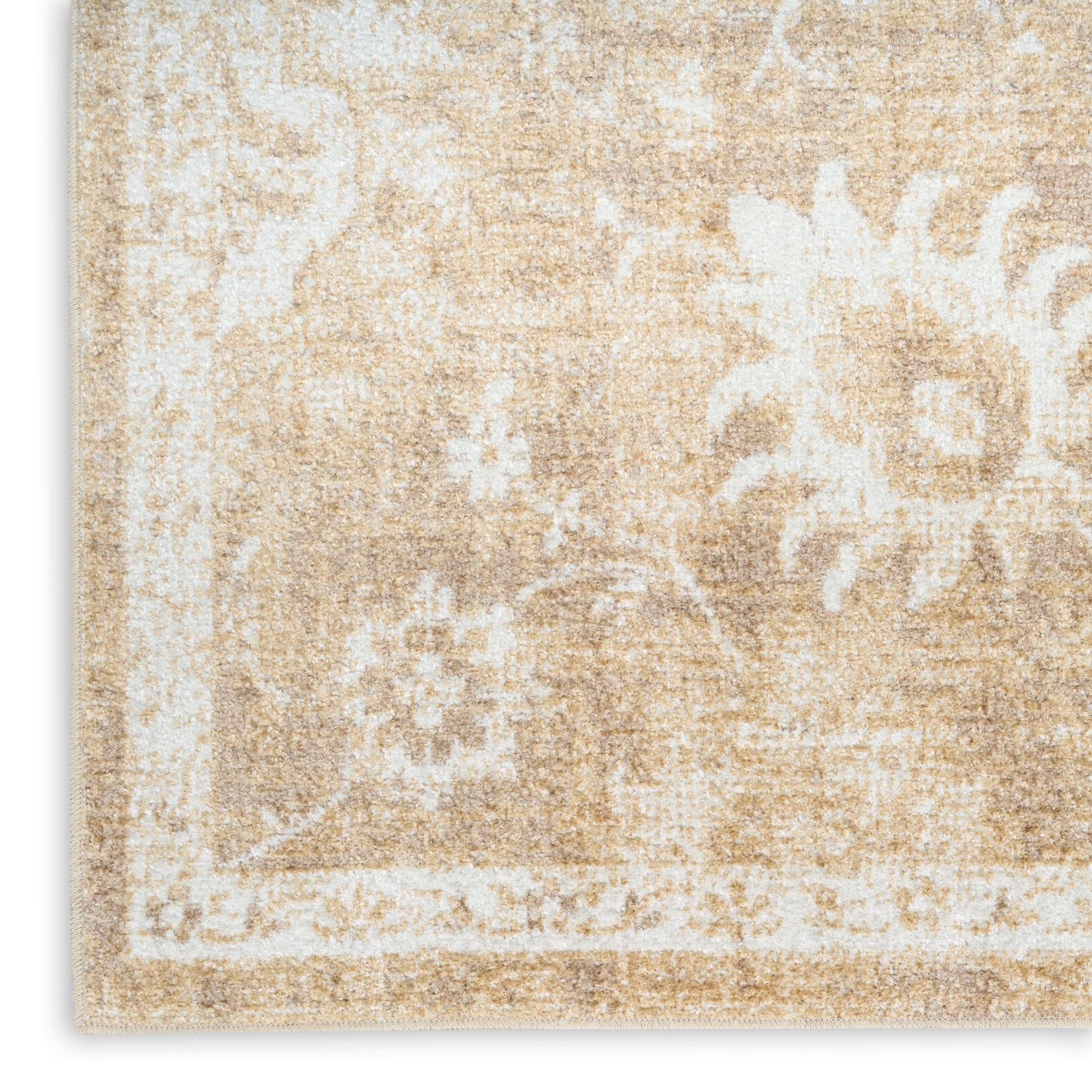 Beige distressed area rug with white damask floral motif; soft woven textile, rectangular neutral home decor.