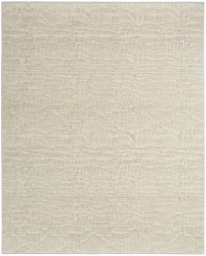 Cream-beige textured area rug with soft, wavy pattern and woven finish.