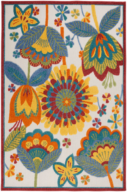 Bright tropical floral rug with large yellow, orange and teal blossoms, blue-green leaves on white with a red border.