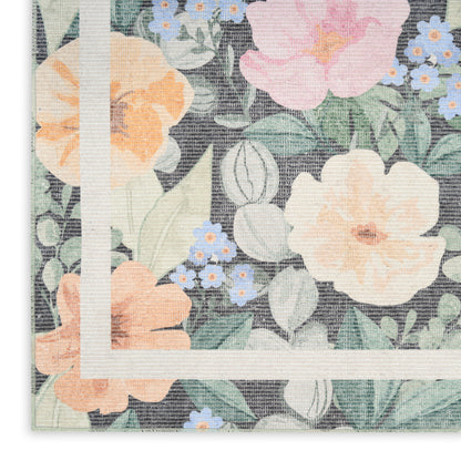 Pastel floral print fabric with peach and pink blooms, blue accents, green leaves, and a white framed border motif.