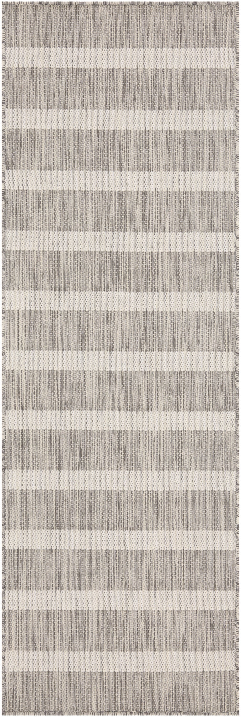 Beige and gray striped woven rug with fringed edges; rectangular, modern home decor.