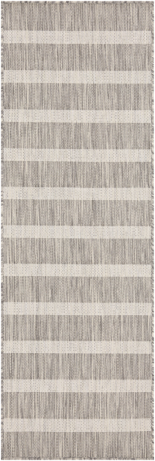 Beige and gray striped woven rug with fringed edges; rectangular, modern home decor.
