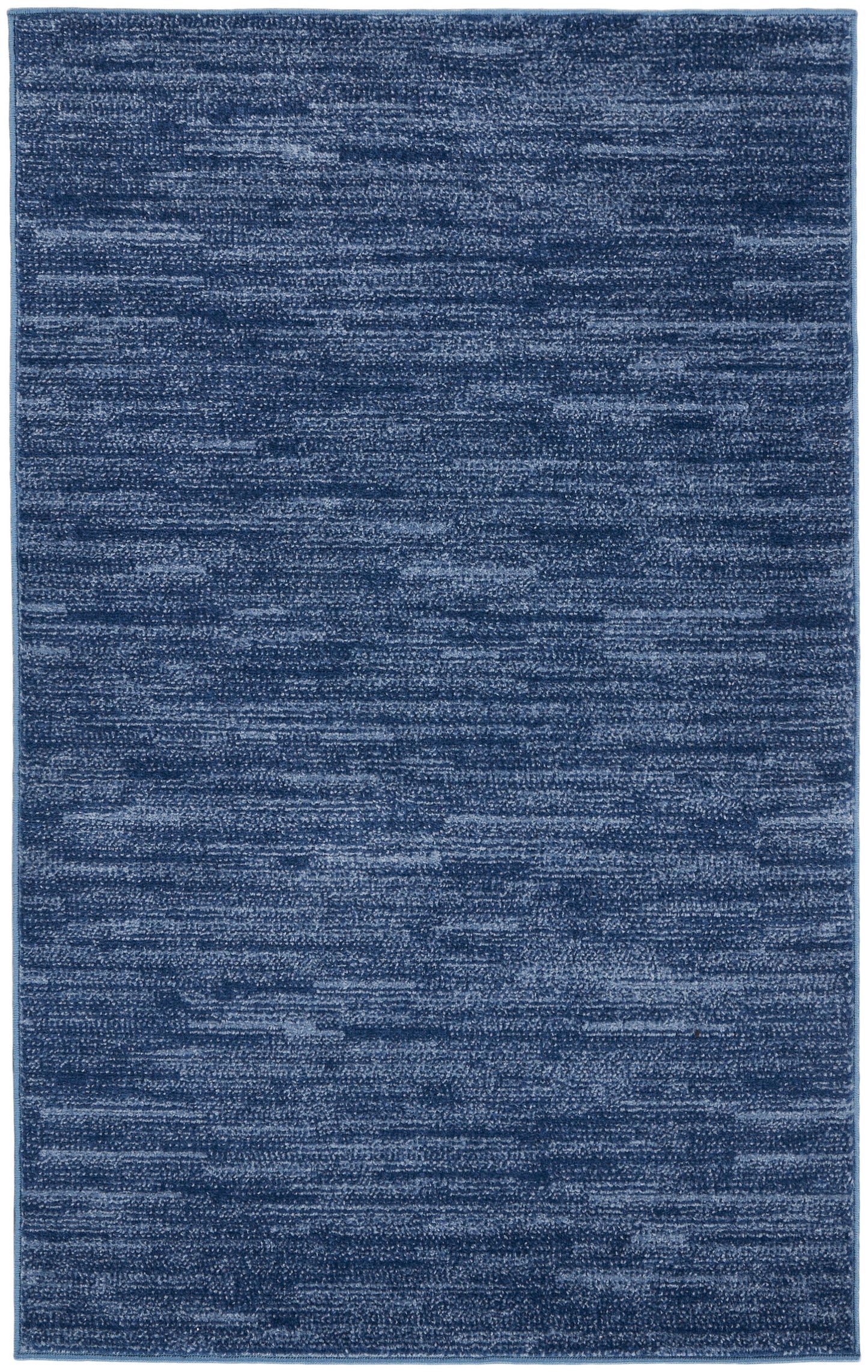 Blue rectangular outdoor rug with a heathered, textured surface in variegated dark & medium blues, 3' x 5'.
