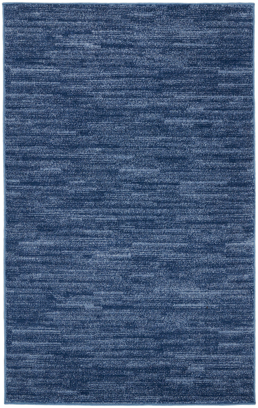 Blue rectangular outdoor rug with a heathered, textured surface in variegated dark & medium blues, 3' x 5'.
