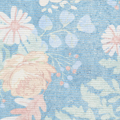Blue floral woven cotton fabric with pink roses and pale green leaves.