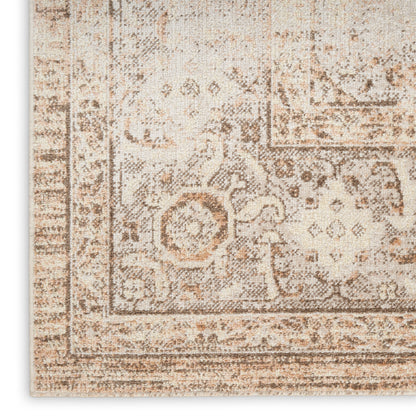Beige distressed oriental rug with brown floral motifs and decorative border; plush woven texture.