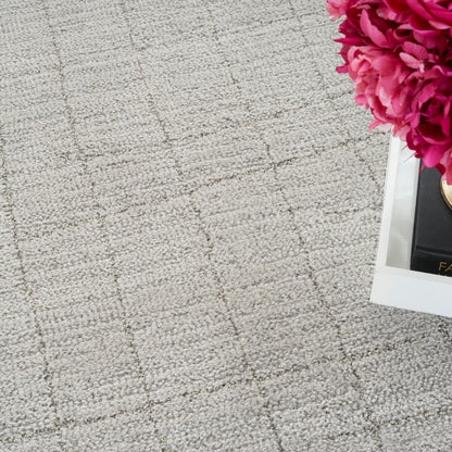 Beige textured rug with a light square grid.