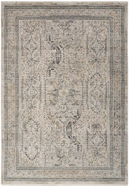 Rectangular distressed Persian-style area rug in ivory, beige and blue-gray with intricate medallions and ornate borders.