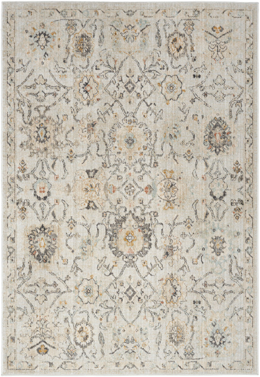 Cream oriental rug with distressed vintage floral medallions, blue-gray and gold accents, bordered rectangle.