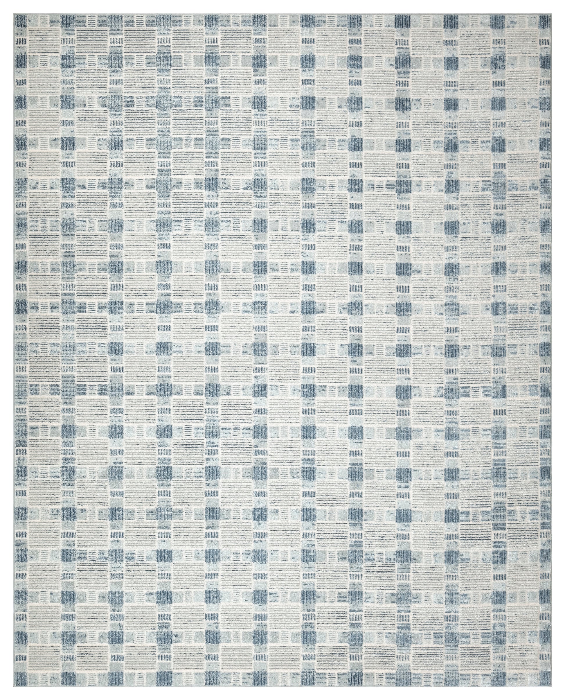 Blue and cream patchwork rug with a geometric grid of small rectangular blocks.