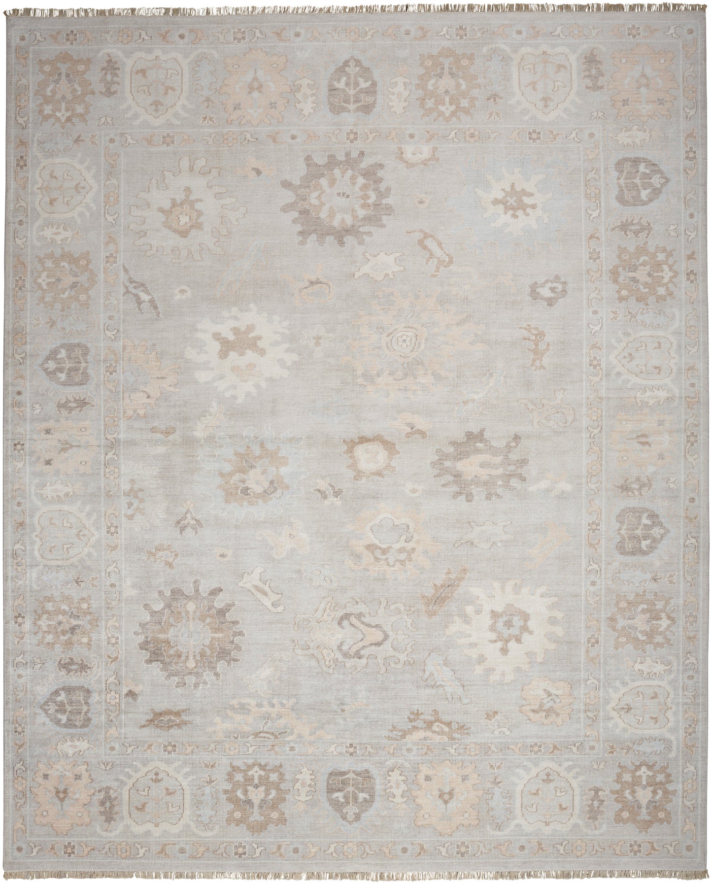 Muted gray-beige oriental rug with faded floral medallions and pale border; distressed, soft pile.