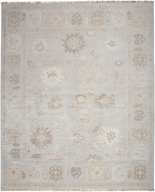 Muted gray-beige oriental rug with faded floral medallions and pale border; distressed, soft pile.
