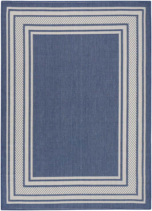Navy blue rectangular rug with white nested rectangular borders and diagonal-striped outer edge; woven texture.