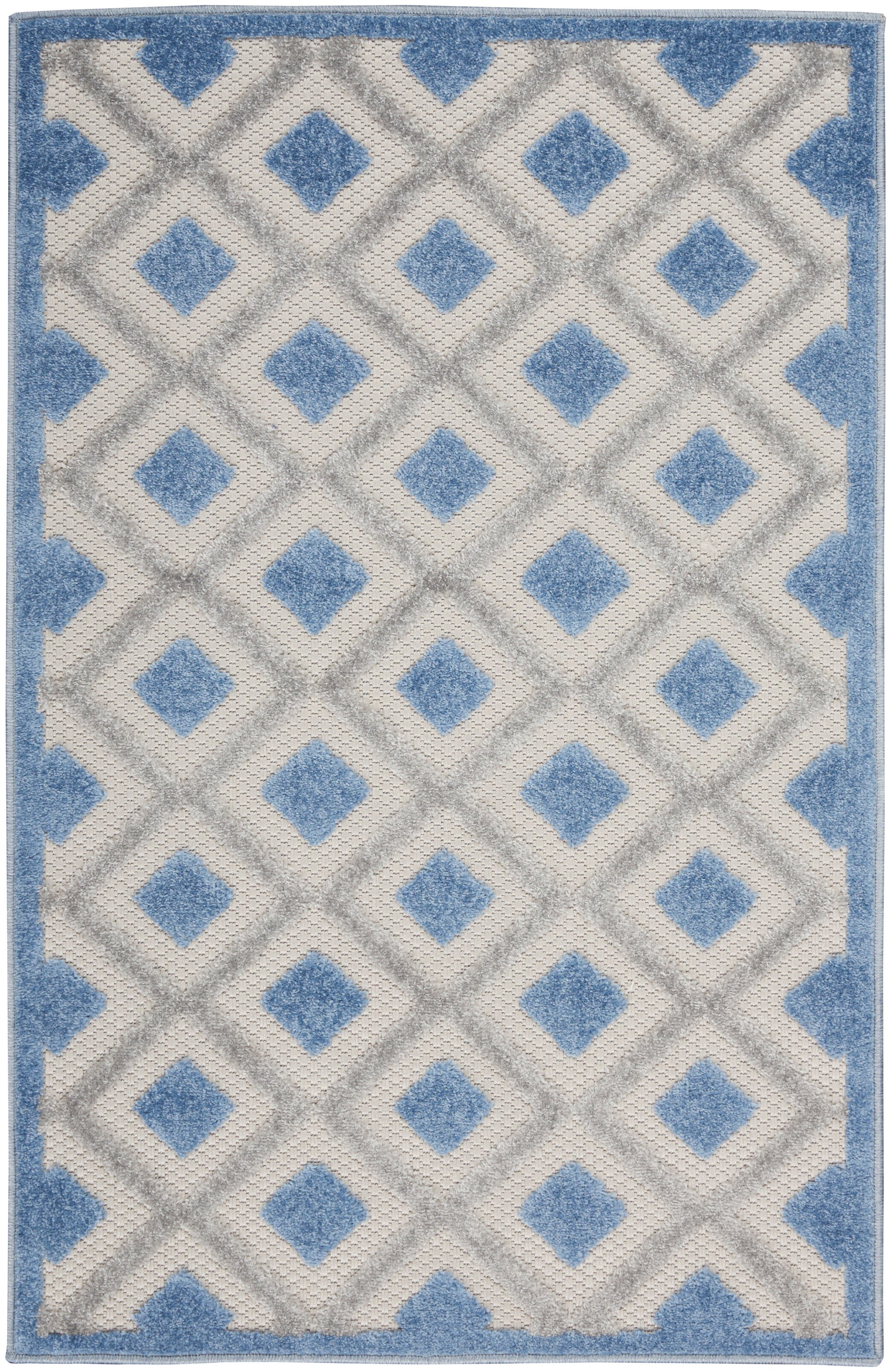 Blue and ivory geometric area rug with diamond lattice pattern and blue border; plush pile.
