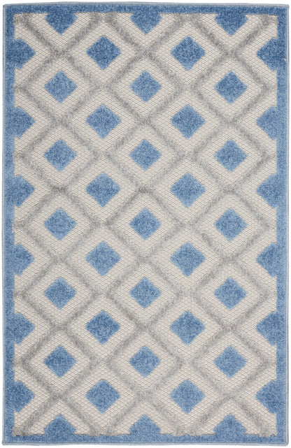 Blue and ivory geometric area rug with diamond lattice pattern and blue border; plush pile.